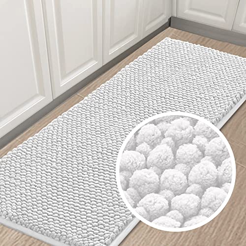 Extra long bath rug runner adorns the bathroom floor